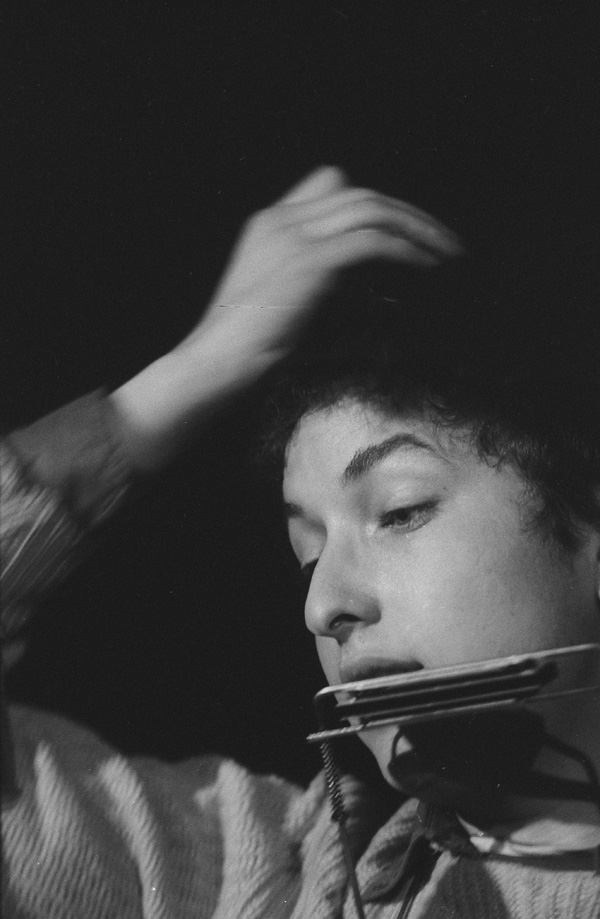 Bob Dylan adjusting his cap