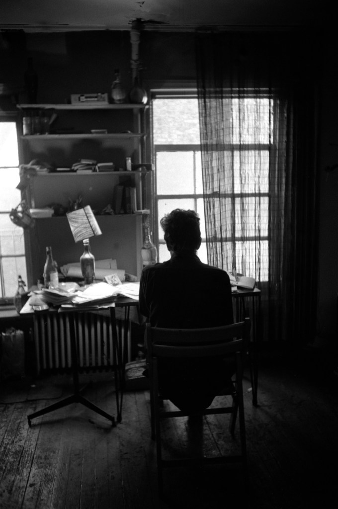 Dylan at his desk. #1 161 W 4th St. 1964.